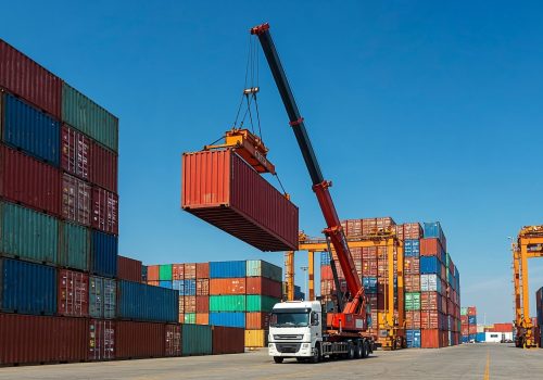 shipping-containers-being-loaded-by-crane-port_23-2151998710